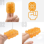 Оранжевый мастурбатор-стимулятор tenga uni topaz